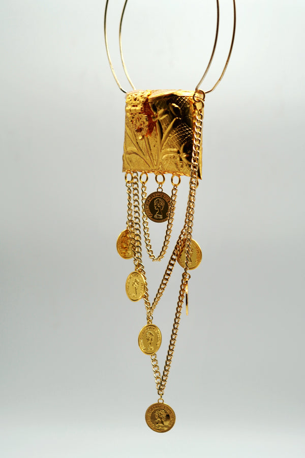 Gold necklace with pendant and chain on a white background