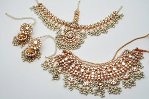 Jewelry set with necklace and earrings on a light background