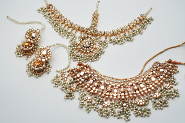 Jewelry set with necklace and earrings on a light background